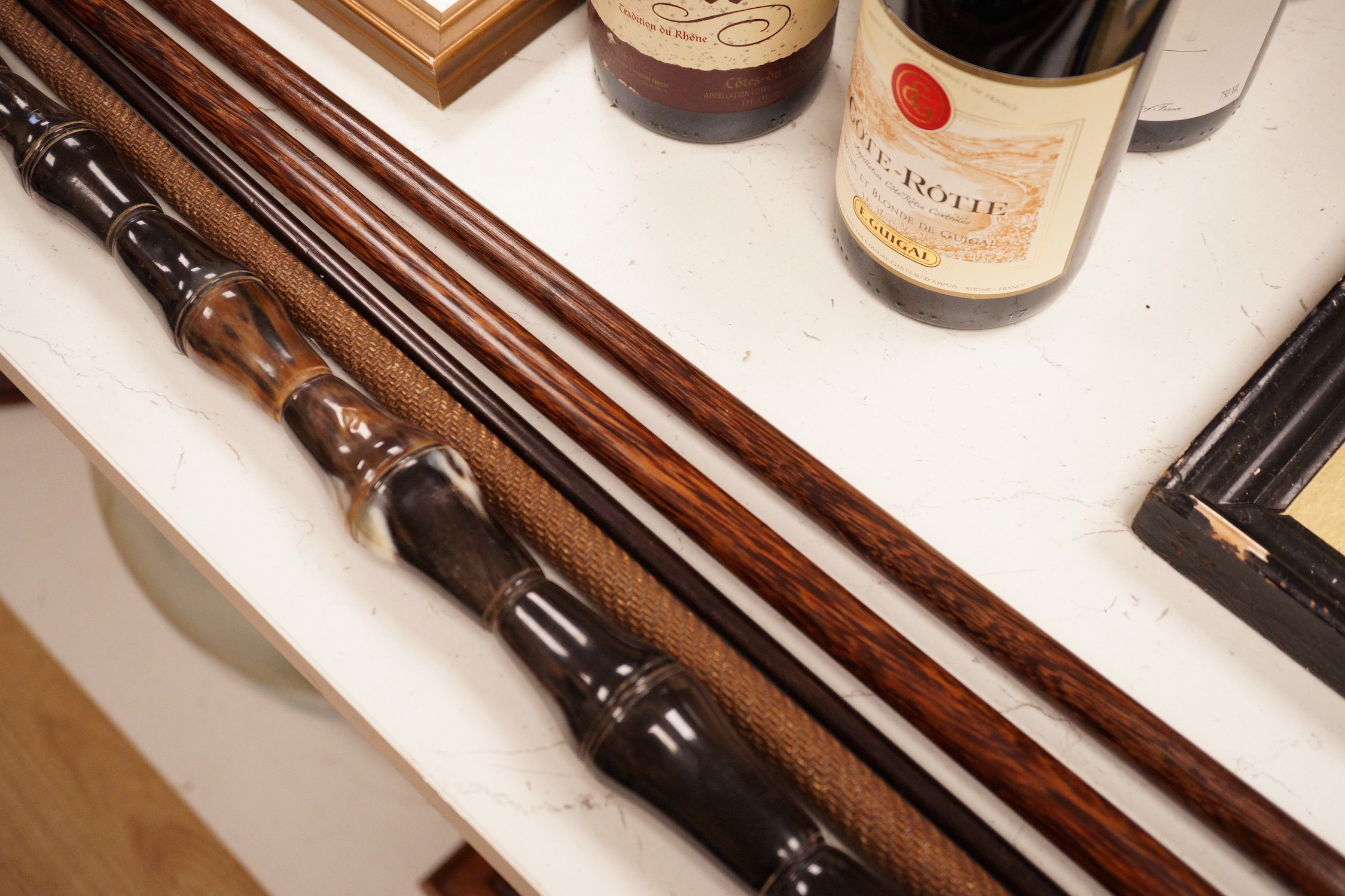 Five assorted walking canes / to include an amboyna example, a sectional horn example, two silver topped etc.